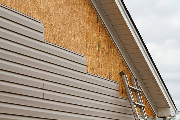 Professional Emergency Siding Repair technician working in Hunker, PA